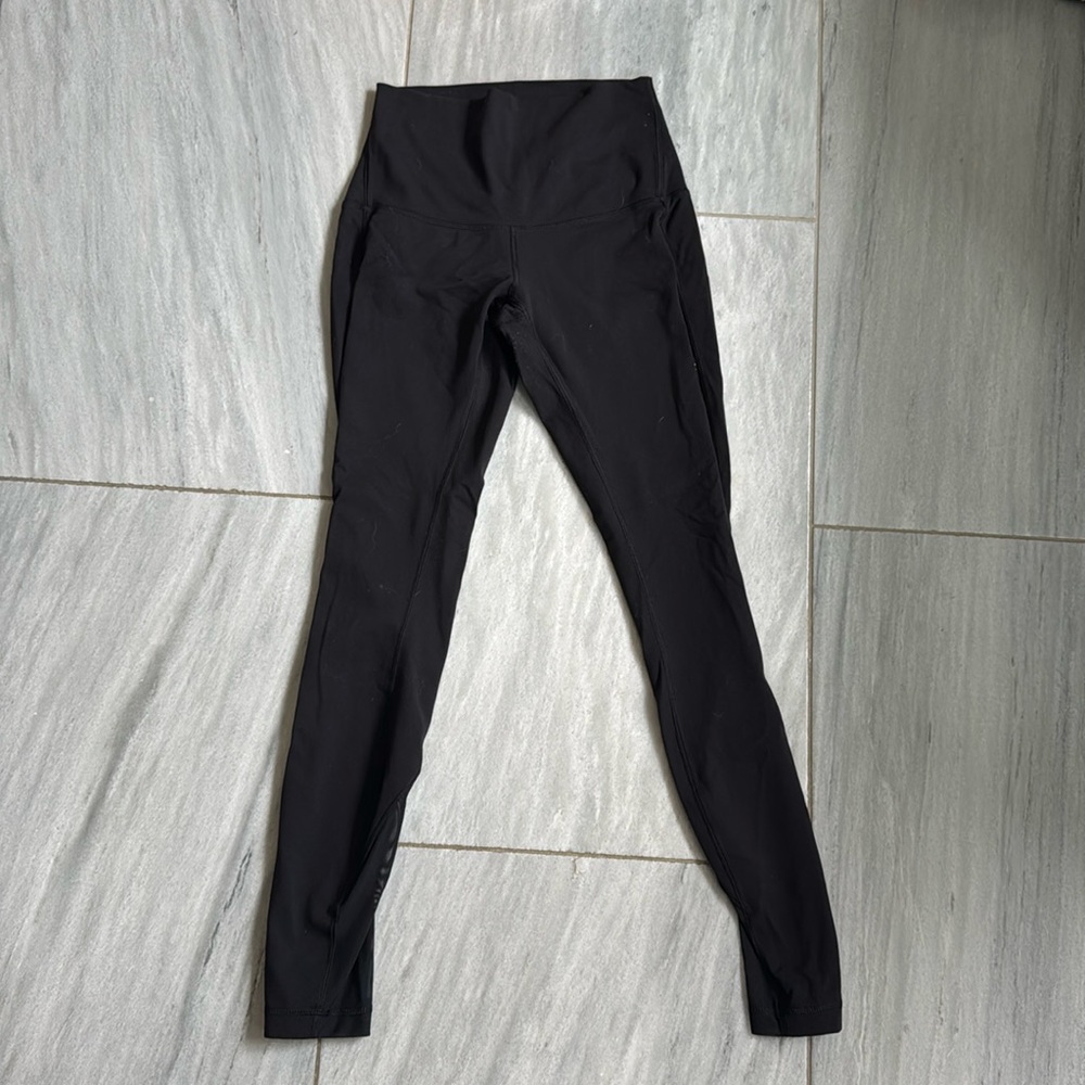 Black lululemon leggings with mesh design down the legs